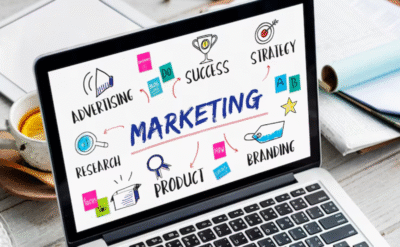 Digital marketing elements on laptop screen showing branding, strategy, research, and advertising for online growth.