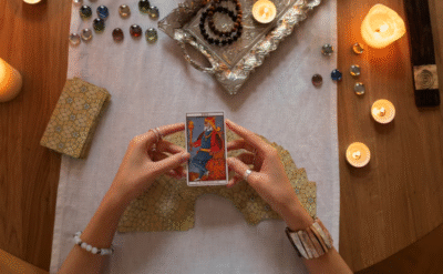 Woman drawing a tarot card for love guidance, symbolizing clarity and connection in relationships.