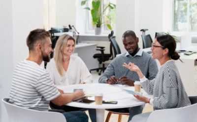 A speaker confidently addressing an audience, demonstrating different types of communication skills for impactful and conscious leadership.