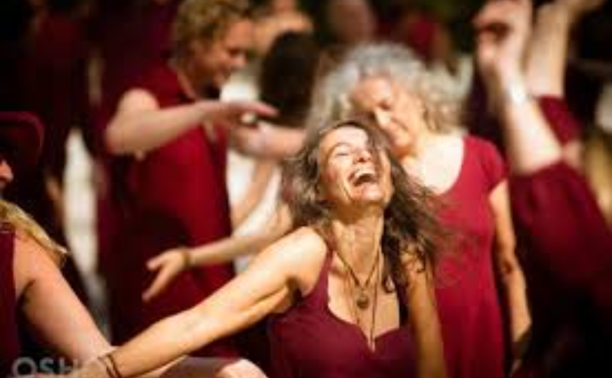 Woman dancing in Osho meditation, embracing spiritual growth